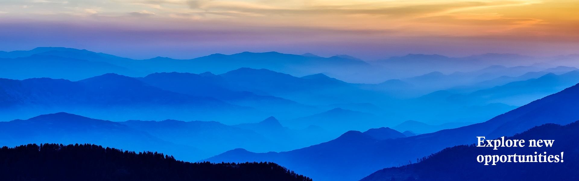 Picture of daybreak over rolling mountains with a caption of: Explore new opportunities