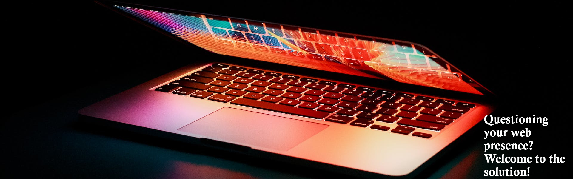 Picture of laptop with a caption of: Questiong your web presence? Welcome to Sleeping Giant web solutions.